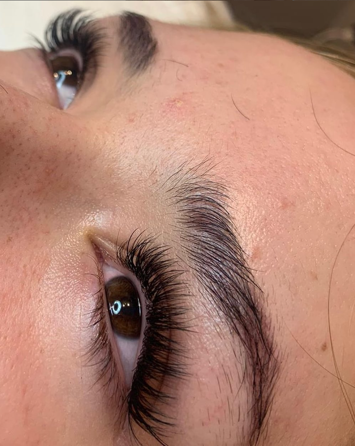 Eyelash extensions and a shaped brow, close up