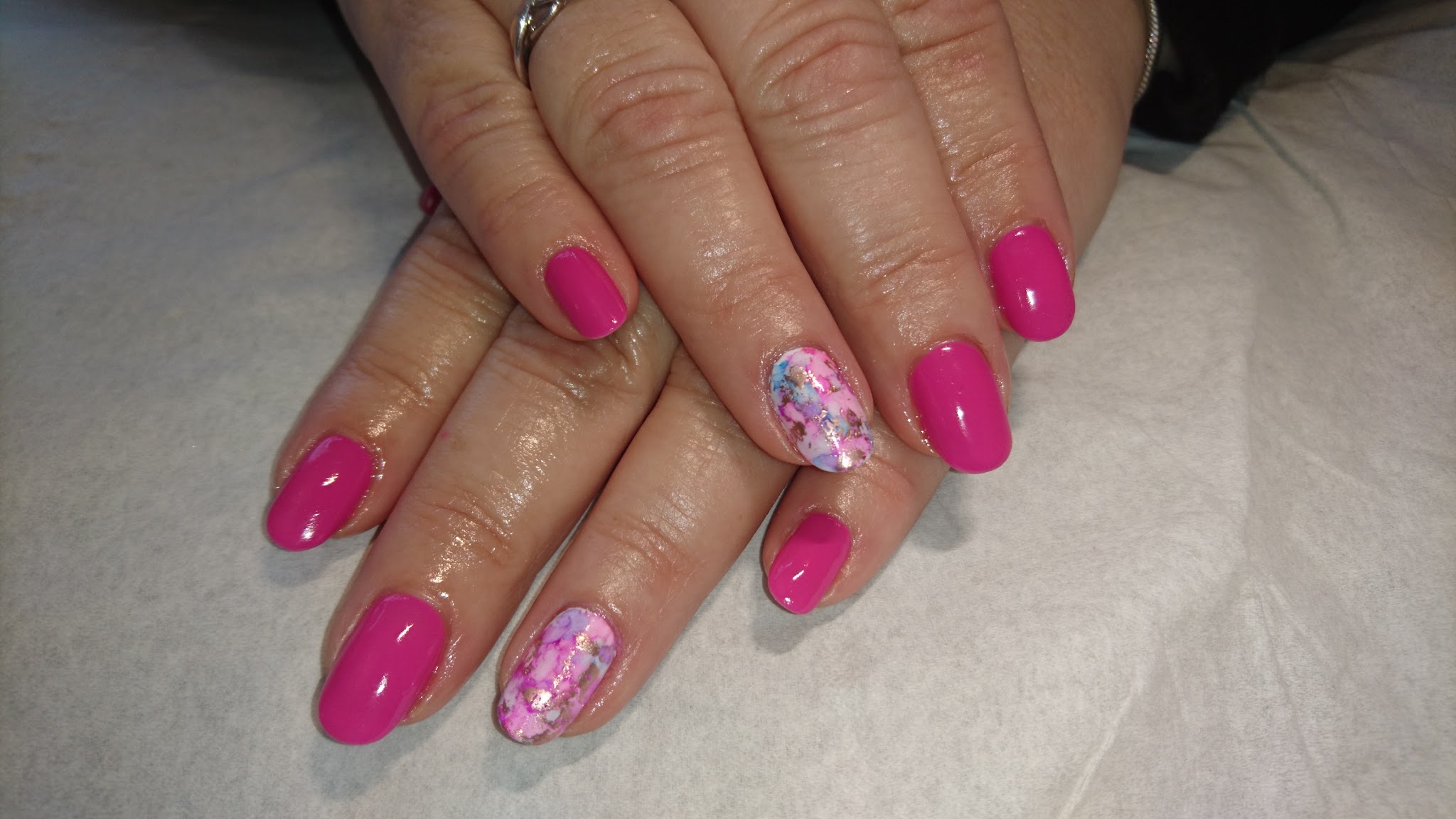 Pink gel nails with floral accent nails